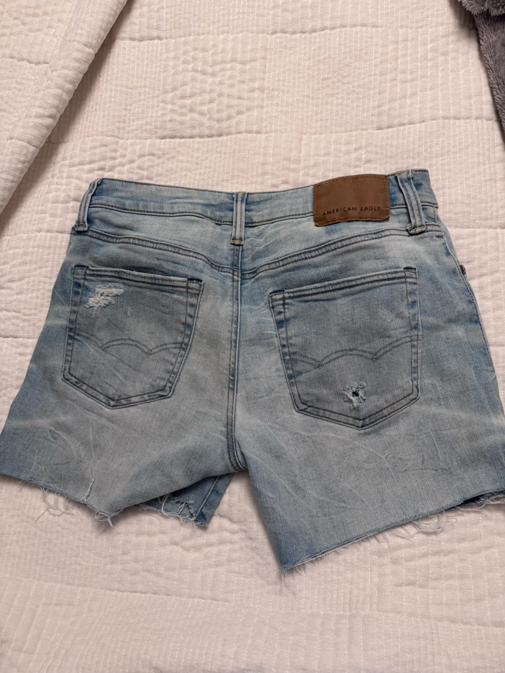 Distressed American Eagle Light Blue cut off jean shorts